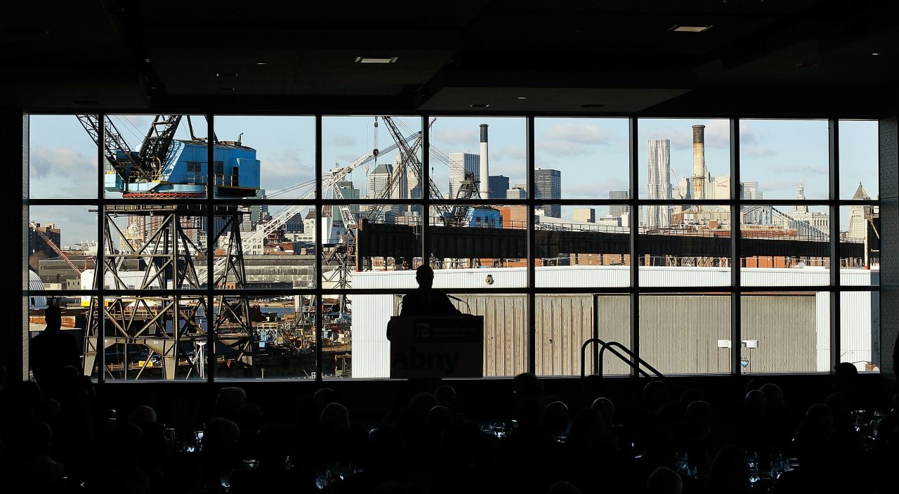 Former New York City Mayor Michael Bloomberg (C) speaks about job creation and the economy to business leaders at Steiner Studios in the Brooklyn Navy Yard, December 2010.