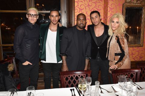 The double world champion (second left) has boosted his mainstream celebrity status by mixing with personalities such as Jared Leto (left), Kanye West (center) and Kim Kardashian (right) at events such as Paris Fashion Week. 
