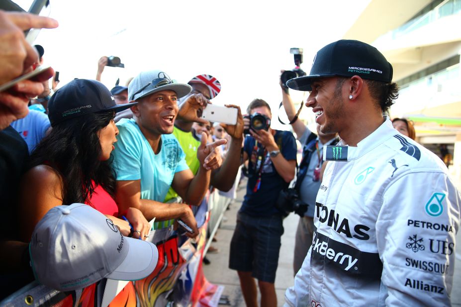 "The reason Lewis is so popular is because he spends a lot of time on social media, he reaches out to his fans and he wears his heart on his sleeve," says Hamilton fan Christopher Thomas, seen talking to his hero at the 2014 U.S. Grand Prix.