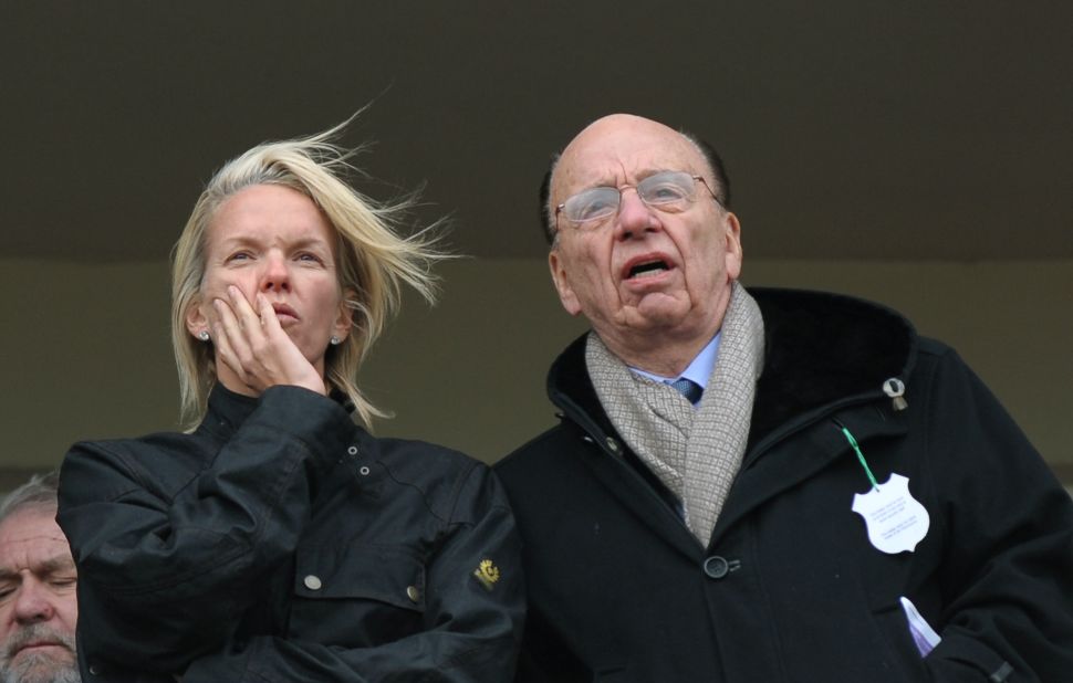 Chipping Norton resident Elisabeth Murdoch, pictured with her father media mogul Rupert Murdoch, on a balcony overlooking horse racing at Cheltenham in 2010.