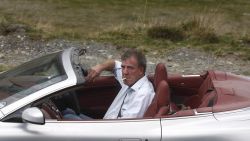 British television BBC presenter of motor show 'Top Gear' Jeremy Clarkson is pictured while he drives an Aston Martin car on Transfagarasan road close to Sibiu city, 300 km northwest from Bucharest, on September 24, 2009. The three presenters, Jeremy Clarkson, Richard Hammond and James May will drive the latest models of Ferrari, Aston Martin and Lamborghini on different roads and cities in Romania as Bucharest, Vidraru dam, Danube Delta and seacoast of Black Sea. AFP PHOTO ANA POENARIU