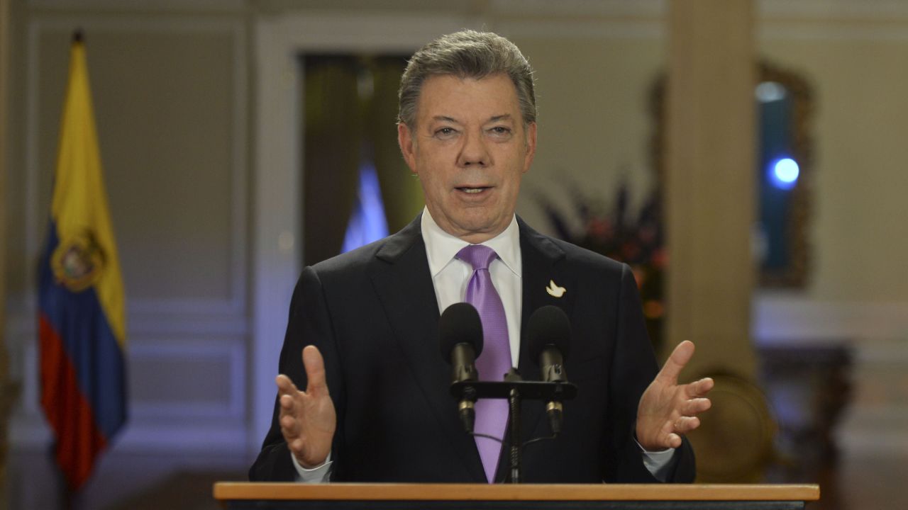 Handout picture released by Colombia's Presidential press office showing Colombian President Juan Manuel Santos addressing the nation at Narino Presidential Palace in Bogota, on March 10, 2015. Colombia's military will temporarily cease bombing raids against Marxist FARC rebels for a month, President Santos announced. The development is a major stride in Colombia's peace process aimed at ending Latin America's longest-running civil war. 