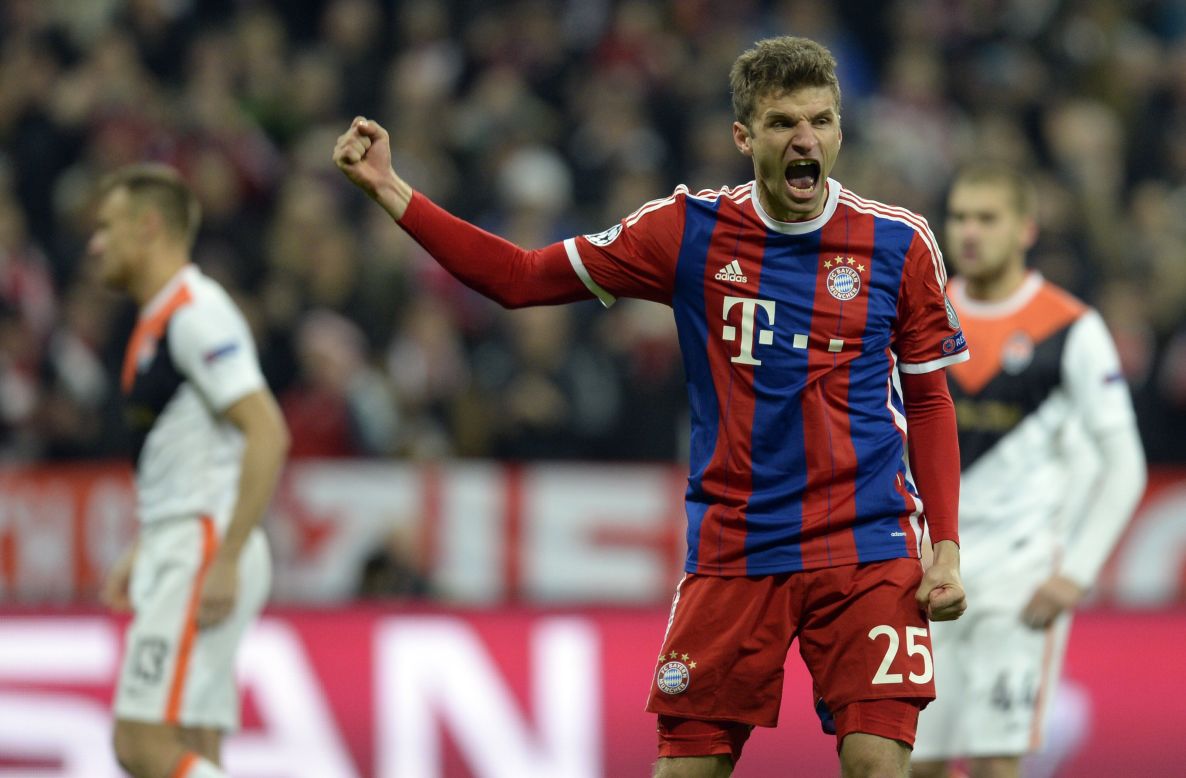 Bayern forward Thomas Muller celebrates tucking home the penalty, as the Ukrainians faced up to the daunting task of playing 85 minutes against the German champions with only 10 men.