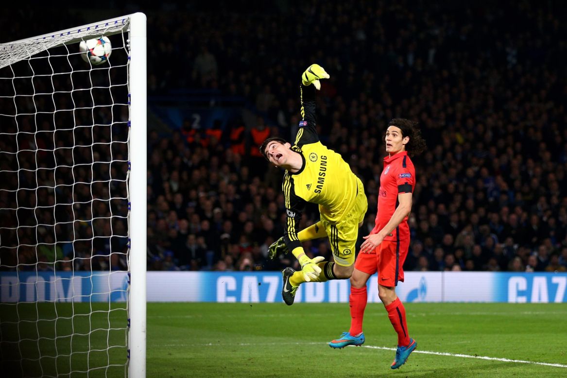 Silva's header loops over Thibaut Courtois to seal PSG's quarterfinal berth. The Brazilian defender (not in picture) made amends for gifting Chelsea a penalty just 12 minutes before his goal.