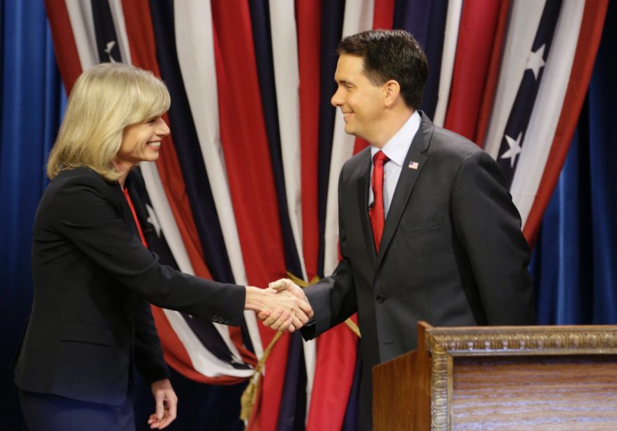 Walker shakes hands with Democrat challenger Mary Burke before facing off in a debate at the WMVS-TV studios October, 17, 2014, in Milwaukee, Wisconsin.