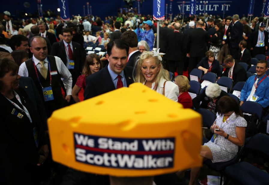 Walker poses with a woman during the Republican National Convention at the Tampa Bay Times Forum on August 28, 2012, in Tampa, Florida. 