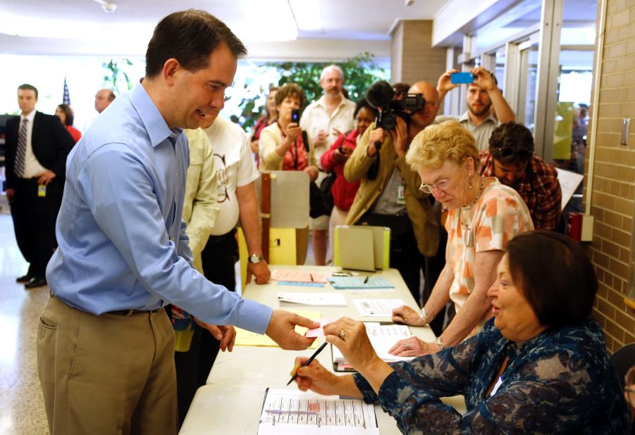 Walker prepares to cast his ballot at Jefferson School to vote in the gubernatorial recall election June 5, 2012, in Wauwatosa, Wisconsin.