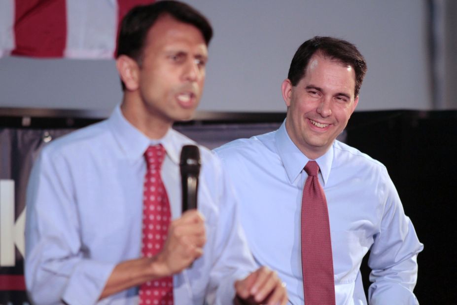 Walker (right) listens to Louisiana Gov. Bobby Jindal speak as they campaign at the Waukesha Victory Center on May 24, 2012, in Waukesha, Wisconsin.