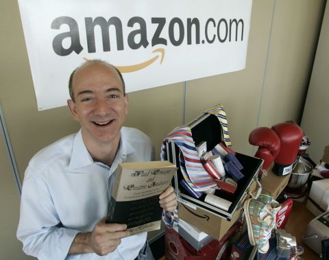 Amazon.com debuted in 1995 and helped turn the Internet into the commercial powerhouse that it is, paving the way for a bevy of services promising easy ordering, quick delivery and cheap prices. Amazon founder and CEO Jeff Bezos is pictured in 2005 with a copy of "Fluid Concepts and Creative Analogies" by Douglas Hofstadter, the first book sold online by Amazon.