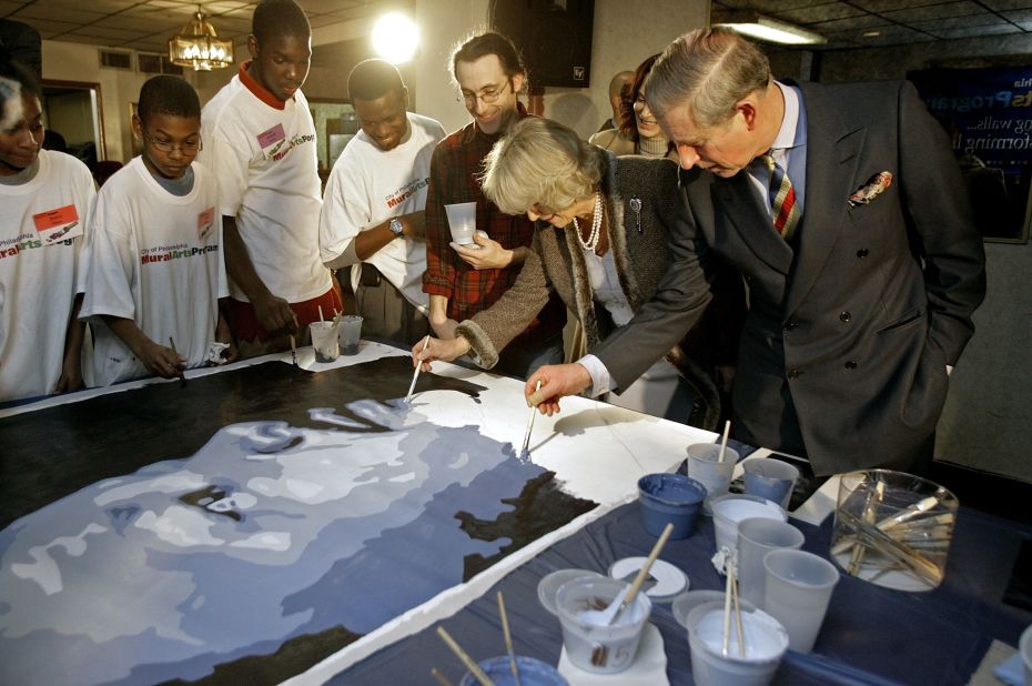 Charles and Camilla add to a mural of Martin Luther King Jr. while in Philadelphia in January 2007.