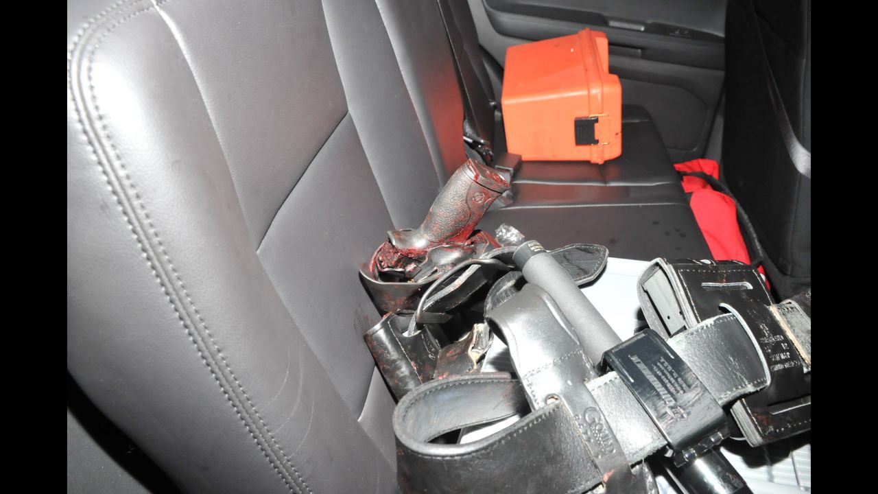 Exhibits related to the shooting death of <a href="http://www.cnn.com/2013/04/19/us/bombings-slain-cop/" target="_blank">MIT Officer Sean Collier</a> were introduced to the jury on Wednesday, March 11. This image from the crime scene appears to show a bloody gun.