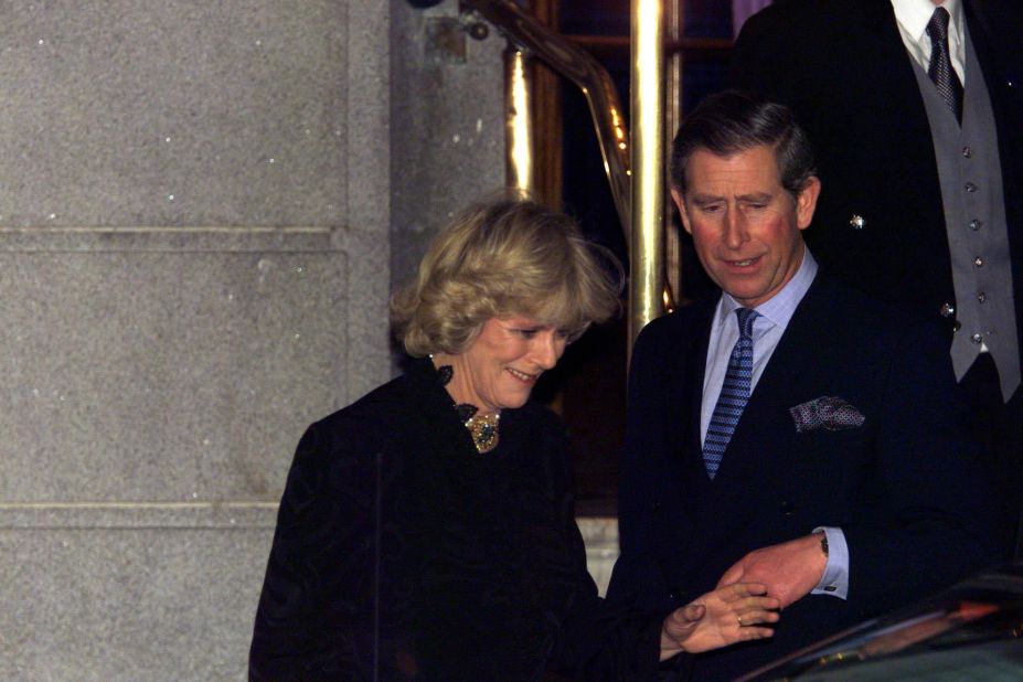 Charles and Camilla make their first public appearance as a couple after leaving a party in London in January 1999.