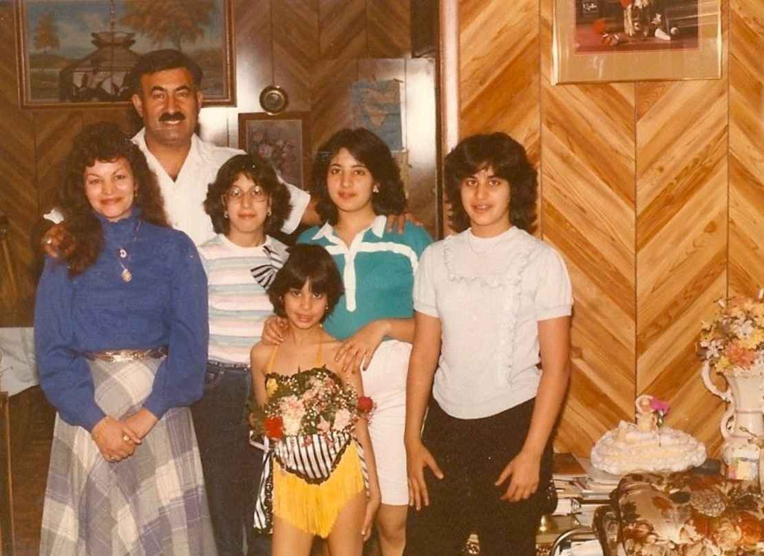 Dressed in a dancing costume, Zayid poses with her parents and siblings.