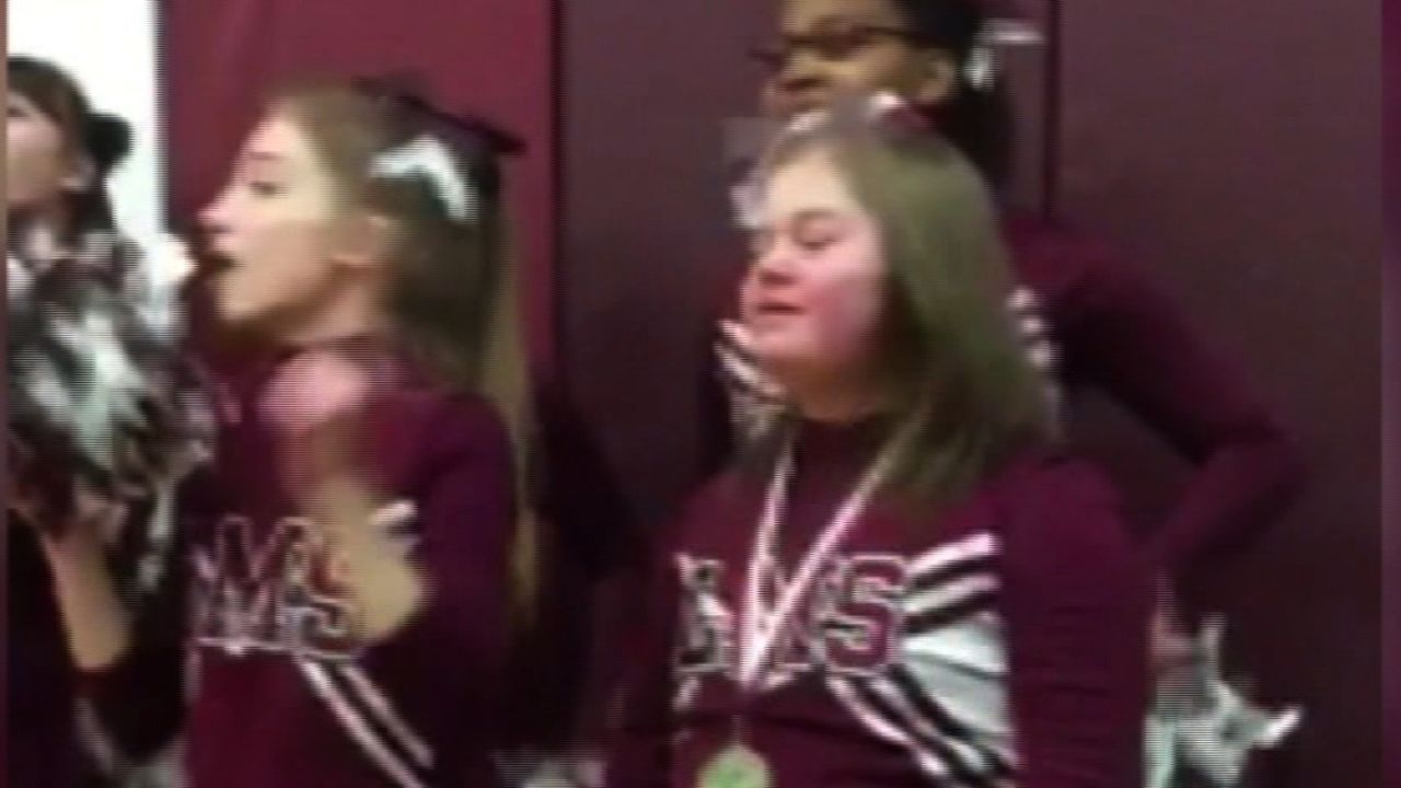 dnt basketball players help cheerleader