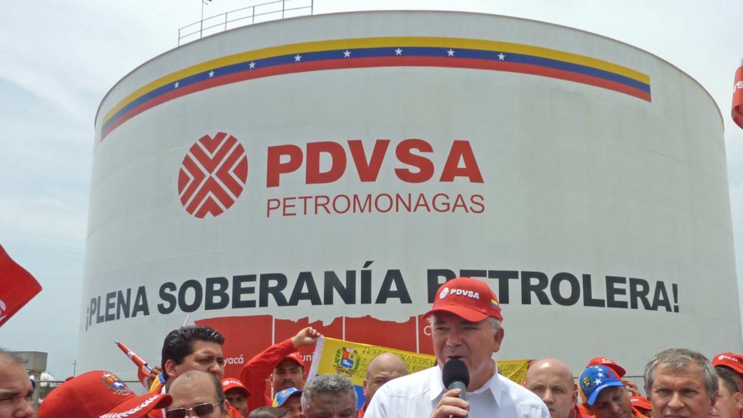 Two former executives of Venezuela's national oil company have been detained, officials said.