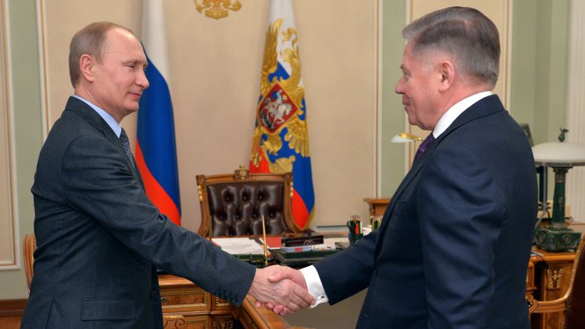 Russian President Vladimir Putin shakes hands with the Supreme Court Chairman Vyacheslav Lebedev, right, in the Novo-Ogaryovo residence outside Moscow, Russia, Friday, March 13, 2015. The Kremlin says Russian President Vladimir Putin, who has been out of public view for more than a week, is to meet on Monday with the president of Kyrgyzstan. (AP Photo/RIA Novosti, Alexei Druzhinin, Presidential Press Service/AP)