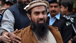 Pakistani security personnel escort Zaki-ur-Rehman Lakhvi as he leaves the court after a hearing in Islamabad on January 1, 2015. 