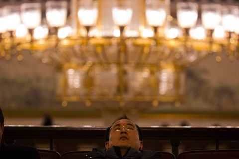 MARCH 13 - BEIJING, CHINA: A man naps in the corridor of the Great Hall of the People during a plenary session of the <a href="http://money.cnn.com/2015/03/10/news/economy/china-billionaire-parliament/">National People's Congress.</a> The annual gathering is <a href="http://money.cnn.com/2015/03/10/news/economy/china-billionaire-parliament/">long on pomp and circumstance but short on legislative deliberation;</a> while some voting takes place, the Communist Party's proposals are always approved.
