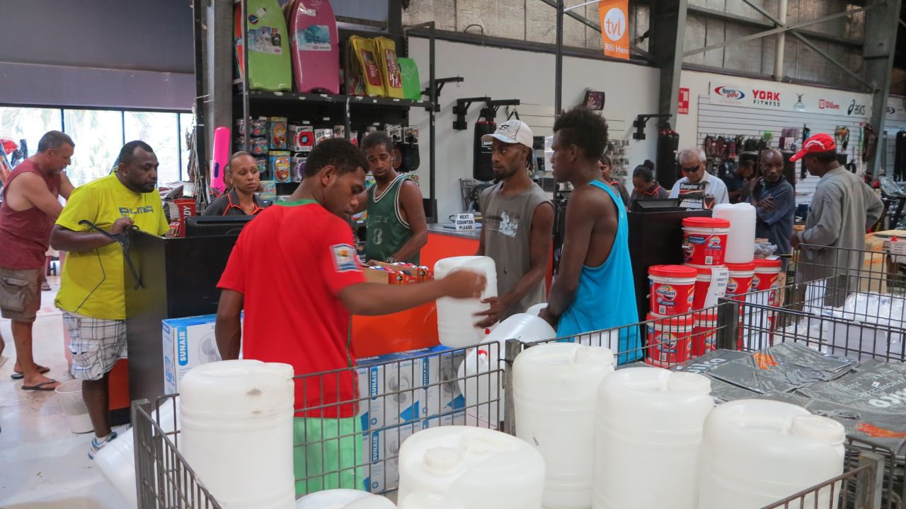 People in Port Vila buy supplies ahead of the storm on March 12.