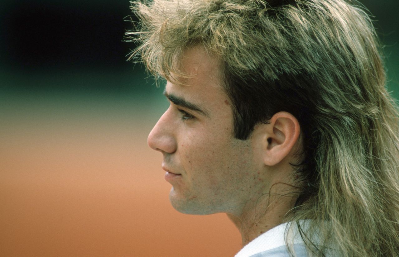 Pictured here in 1998 tennis legend Andre Agassi rocked long hair for many years. In his autobiography "Open" the star wrote that his long hairdo during the 1990s was actually a wig.