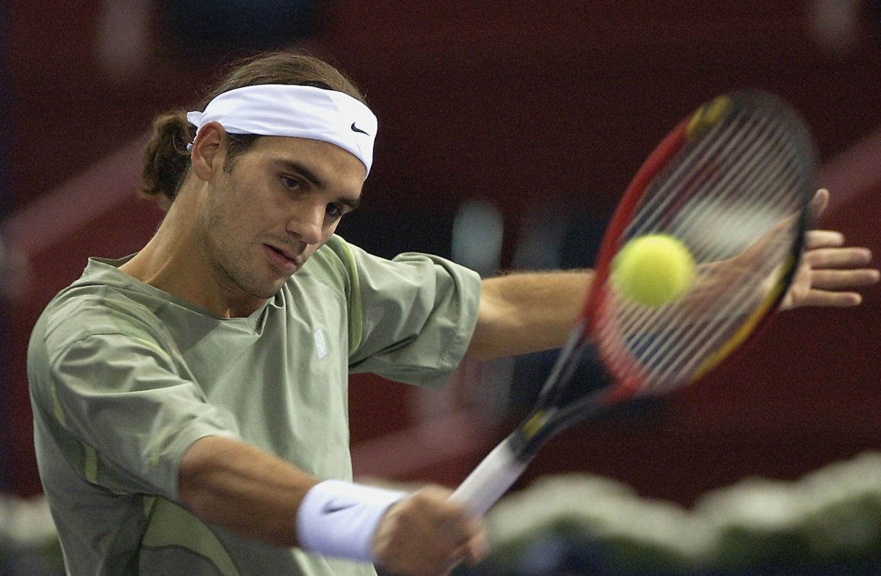 Back in 2002, Roger Federer liked the ponytail look but has since opted for shorter locks.