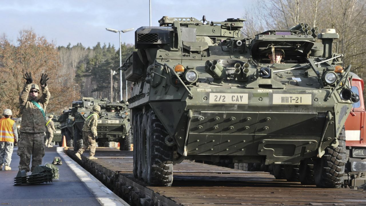 Dragoons assigned to Head Hunter Troop, 2nd Squadron, 2nd Cavalry Regiment load their Strykers and equipment onto a local railway as they prepare for their upcoming rotation in support of Operation Atlantic Resolve at Rose Barracks, Germany, March 11, 2015.