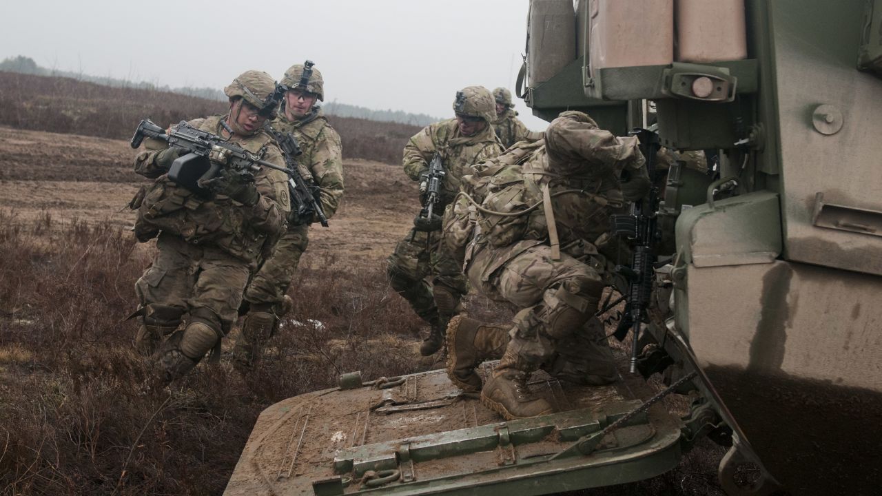 U.S. troopers of 3rd Platoon, Lightning Troop, 3rd Squadron, 2nd Cavalry Regiment, load into a Stryker during a live-fire joint training exercise with Lithuanian soldiers of 3rd Company, Algirdas Mechanized Infantry Battalion, in support of Operation Atlantic Resolve, on March 2, 2015. 