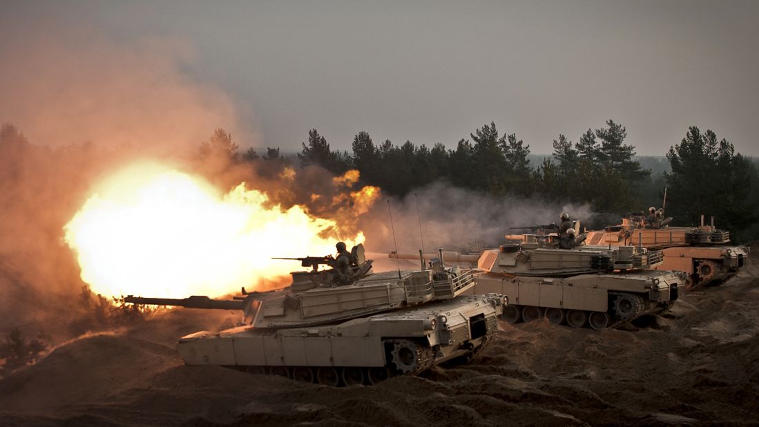 U.S. soldiers fire ceremonial rounds from M1A2 Abrams tanks at the Adazi training area, in Latvia, last November. 