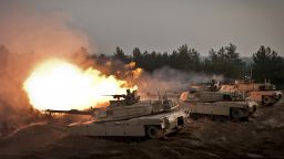 U.S. soldiers fire ceremonial rounds from M1A2 Abrams Tanks at the Adazi Training Area, Latvia, Nov. 6, 2014.