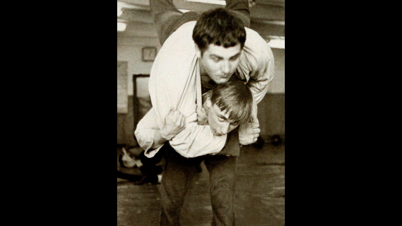 Putin, bottom, wrestles with a classmate in St. Petersburg, Russia, in 1971.   