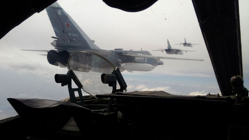Russian Air Force Su-24 bombers fly during a military exercise