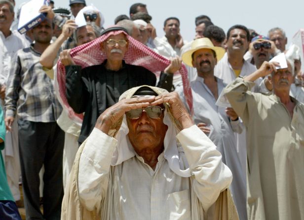 A far more controlled reaction from the crowd at the Equestrian Club in Baghdad, Iraq. The city's main race track was closed during the war, but reopened in June, 2003, attracting over 3,000 fans in the first day alone.