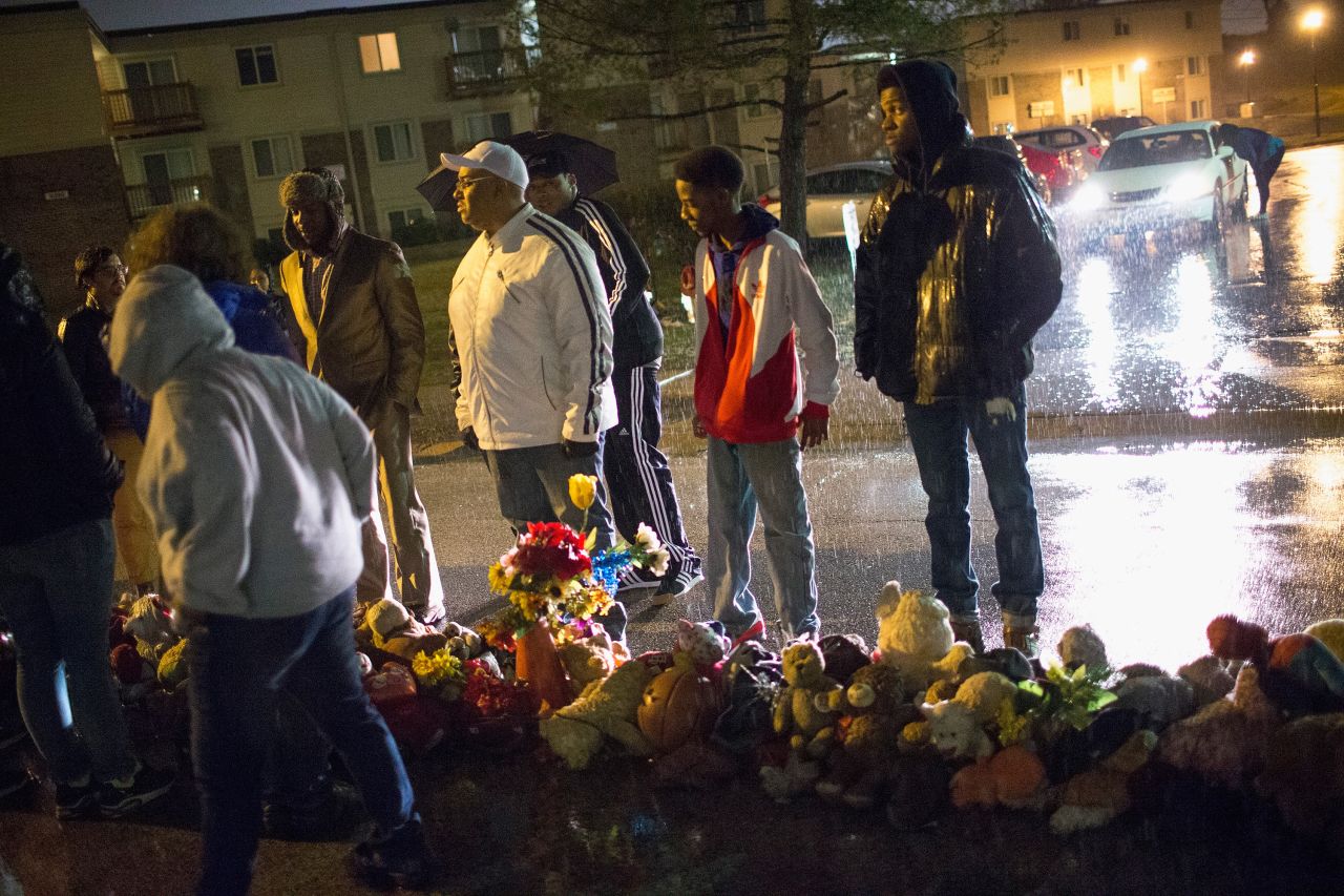 Demonstrators visit a memorial to Michael Brown on Friday, March 13, in Ferguson, Missouri. 