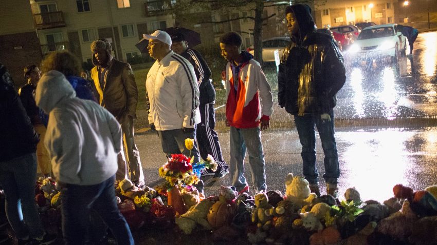 Demonstrators visit the Michael Brown memorial to say a prayer on Friday, March 13 in Ferguson, Missouri.