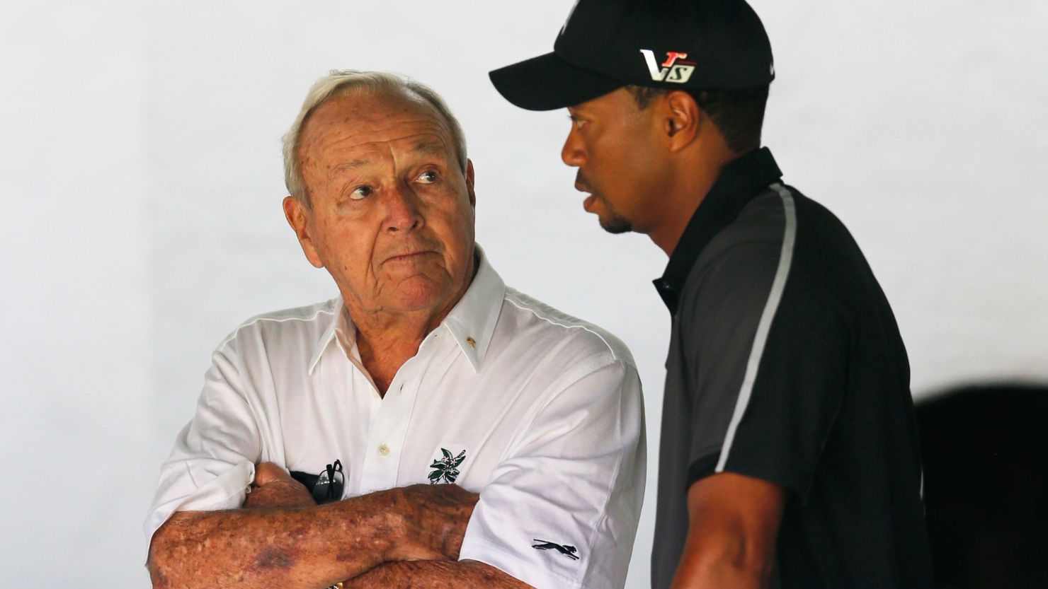 Tiger Woods talks with Arnold Palmer prior to his practice round before the 2013 U.S. Open.