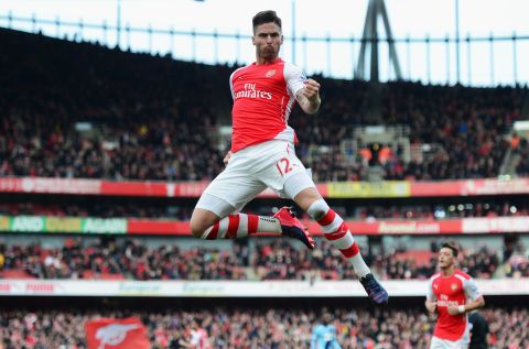 France striker Olivier Giroud celebrates after scoring Arsenal's opening goal against London rival West Ham, which left the Gunners a point behind second-placed Man City. 