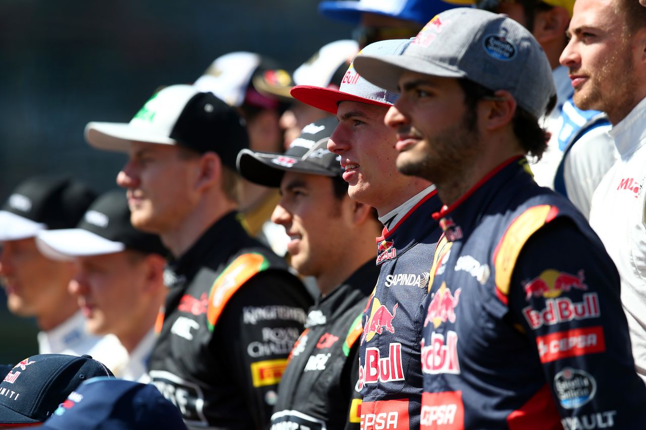 Dutch teenager Max Verstappen (second right) poses for the pre-race photo before making history as the youngest driver to compete in an F1 Grand Prix.