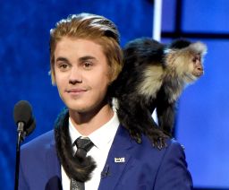 Justin Bieber and his monkey appear onstage at his Comedy Central roast.