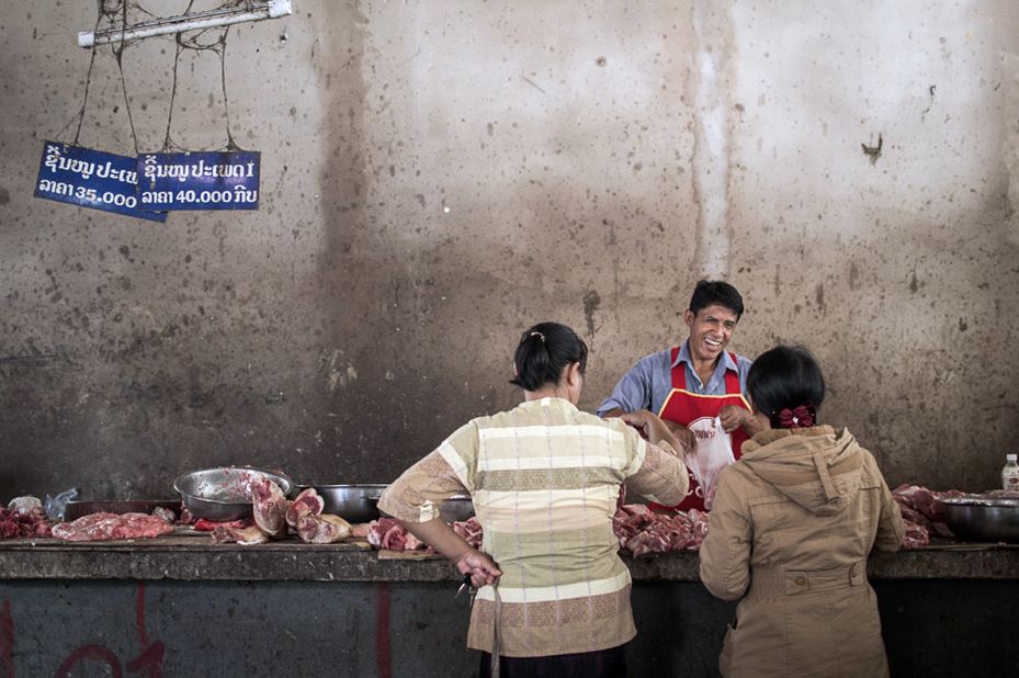"The happiest butcher we have ever seen, in Luang Namtha, northern Laos," says Petit. 