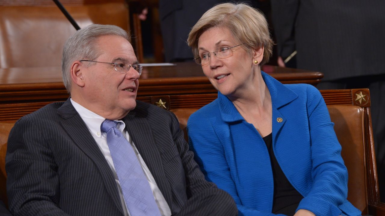 Senators Warren and Bob Menendez (D-NJ) talk before the State of the Union address by President Obama on January 20, 2015 in the House Chamber of the U.S. Capitol.