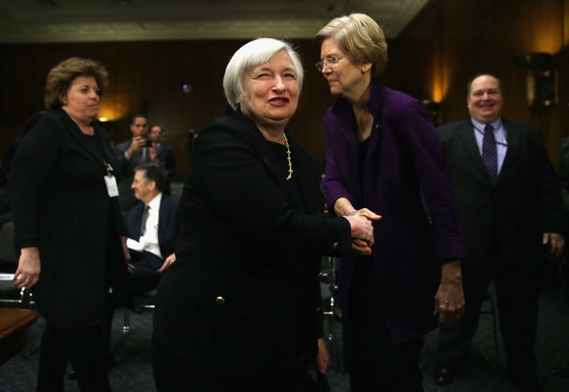 Then-nominee for the Federal Reserve Board Chairman Janet Yellen (left) shakes hands with Warren (Right) after her confirmation hearing before Senate Banking, Housing and Urban Affairs Committee on November 14, 2013, on Capitol Hill.