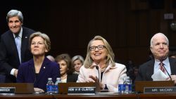 (Left to Right): Former Senator John Kerry, Sen. Warren, then-Secretary of State Hillary Clinton and Sen. John McCain, are seated at Kerry's State Department confirmation hearing on Capitol Hill on January 24, 2013.