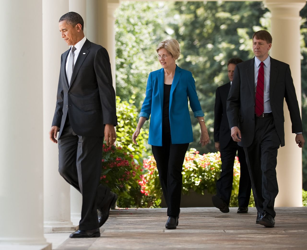 President Obama (left) and former financial adviser Elizabeth Warren (left) arrive at the nomination of former Ohio Attorney General Richard Cordray (right) to lead a consumer protection bureau at the White House on July 18, 2011.