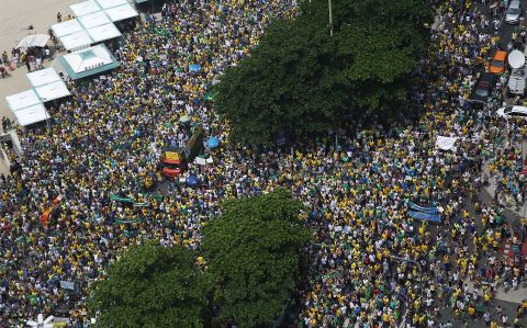 In Rio de Janeiro, they gathered along Copacabana beach, as pictured. In the capital, Brasilia, protesters marched on government headquarters.