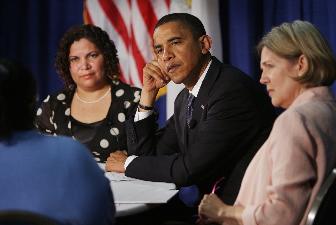Then-Democratic presidential candidate Barack Obama (center) listens to questions with Rosa Figueroa (left) and Warren while hosting an economic round table at the Illinois Institute of Technology on June 11, 2008, in Chicago.