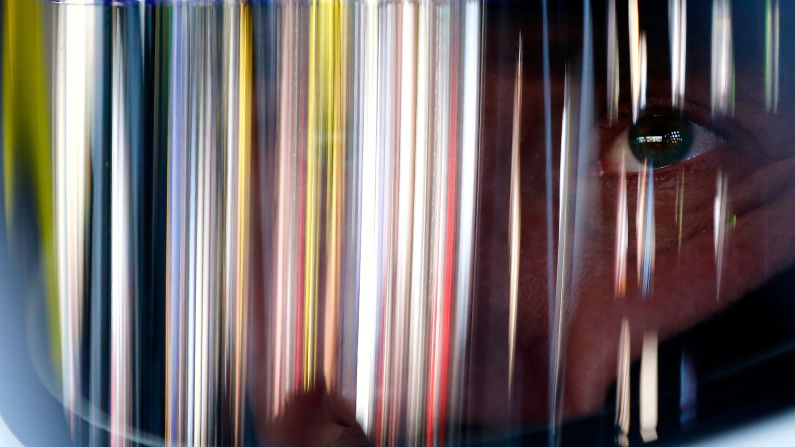 Light is reflected off the helmet of NASCAR driver Brian Vickers as he prepares for practice Friday, March 13, at Phoenix International Raceway.