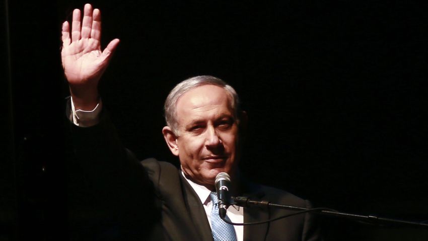 Caption:Israeli Prime Minister and Likud party's candidate running for general elections, Benjamin Netanyahu gestures to his supporters during a campaign rally on March 15, 2015, in Rabin Square in the Israeli costal city of Tel Aviv. Two days before Israel's election, Netanyahu make a last-ditch effort to garner support by appealing to the centre and heading for a mass rally in Tel Aviv. AFP PHOTO / GALI TIBBON (Photo credit should read GALI TIBBON/AFP/Getty Images)