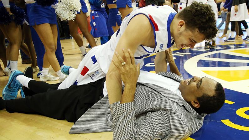 Georgia State's R.J. Hunter celebrates with his father, head coach Ron Hunter, after they won the Sun Belt tournament Sunday, March 15, in New Orleans. Ron Hunter tore his Achilles tendon during the celebrations, but he said that won't keep him from coaching the team in the NCAA Tournament.  