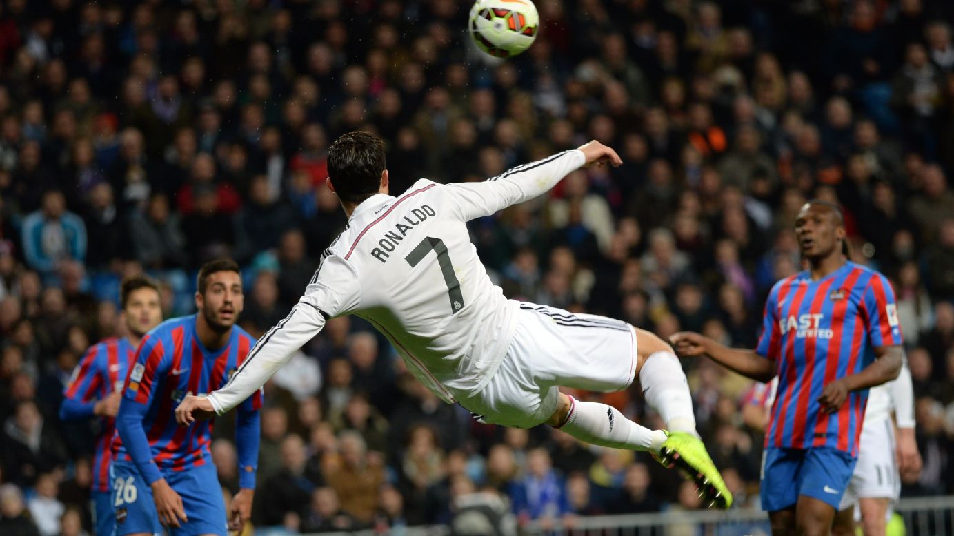 Real Madrid's Cristiano Ronaldo, the reigning World Player of the Year, turns his body to volley the ball Sunday, March 15, during a Spanish league match against Levante in Madrid.