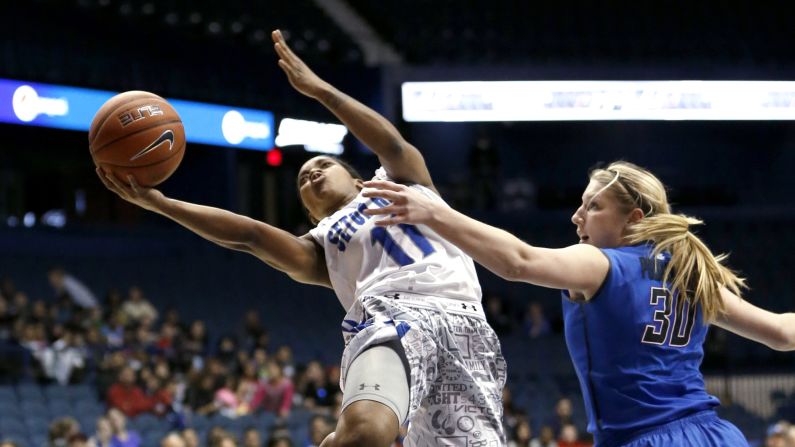 Seton Hall guard Ka-Deidre Simmons drives past DePaul forward Megan Podkowa during the final of the Big East tournament Tuesday, March 10, in Rosemont, Illinois. DePaul won the game 78-68. 